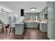 Beautiful kitchen with stainless appliances, white quartz counters, and light green cabinets at 2512 Hidden Hills Dr, Marietta, GA 30066