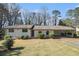 Charming single-story home with stone accents and a covered carport at 803 Denise Sw Ct, Stone Mountain, GA 30087