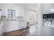 Well-lit kitchen with white cabinetry and updated flooring at 803 Denise Sw Ct, Stone Mountain, GA 30087