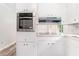 Updated kitchen features stainless steel oven, white cabinetry, and sleek countertops at 803 Denise Sw Ct, Stone Mountain, GA 30087