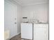 Laundry room with a side by side washer and dryer, access door, and luxury vinyl flooring at 803 Denise Sw Ct, Stone Mountain, GA 30087