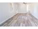 Bright living room featuring new grey tone flooring and neutral paint at 803 Denise Sw Ct, Stone Mountain, GA 30087