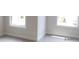 Bedroom with light gray carpet and natural lighting through bright windows at 1062 Crest Mill Dr, Marietta, GA 30008