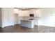 Spacious kitchen with stainless steel appliances, white cabinets, and gray countertops at 1062 Crest Mill Dr, Marietta, GA 30008