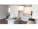 Modern kitchen featuring white cabinets, gray countertops, and stainless steel appliances at 1062 Crest Mill Dr, Marietta, GA 30008