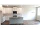 Bright open kitchen with granite countertops, stainless steel appliances, and a center island at 1062 Crest Mill Dr, Marietta, GA 30008