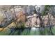 Aerial view of a backyard with mature trees and access to a tranquil lake at 3179 Dunlin Lake Rd, Lawrenceville, GA 30044