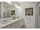 Bright bathroom with a double sink vanity, a large mirror, and tiled shower at 2159 James Aly, Atlanta, GA 30345