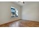 Bright bedroom featuring hardwood floors, trim, and natural light streaming through double windows at 2159 James Aly, Atlanta, GA 30345