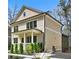 Charming two-story home with neutral siding, white trim, a front porch, and manicured landscaping at 2159 James Aly, Atlanta, GA 30345