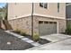 Attached two-car garage with brick facade and landscaping for a stylish exterior at 2159 James Aly, Atlanta, GA 30345
