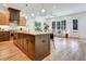 Open-concept kitchen flows into the living area, offering a large island and modern amenities for seamless entertaining at 2159 James Aly, Atlanta, GA 30345