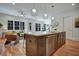 Stylish kitchen with stainless appliances, island with seating, and hardwood floors offer a modern living space at 2159 James Aly, Atlanta, GA 30345