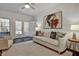 Comfortable living room with neutral furniture, rug, ceiling fan, and ample natural light at 2159 James Aly, Atlanta, GA 30345