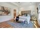 Main bedroom showcasing tray ceiling, a walk-in closet, neutral walls, and great natural light at 2159 James Aly, Atlanta, GA 30345