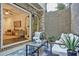 Outdoor patio with seating area, table, and garden with views to an indoor living room at 2159 James Aly, Atlanta, GA 30345