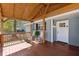 Inviting covered porch with rocking chairs, a wood ceiling, and a welcoming front door at 2958 Forelock Sw Pl, Marietta, GA 30064