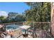 Balcony featuring a table and a view of the pool surrounded by lush trees at 385 Ralph Mcgill Ne Blvd # D, Atlanta, GA 30312