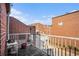 Balcony featuring a white wicker table and brick buildings in the distance at 385 Ralph Mcgill Ne Blvd # D, Atlanta, GA 30312