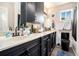 Bathroom featuring double sinks, modern fixtures, and a black toilet at 385 Ralph Mcgill Ne Blvd # D, Atlanta, GA 30312