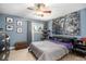 Comfortable bedroom featuring an area rug, ceiling fan, and a large wall decoration at 385 Ralph Mcgill Ne Blvd # D, Atlanta, GA 30312