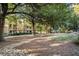 Green space featuring mulch, rocks, and large shade trees near community buildings at 385 Ralph Mcgill Ne Blvd # D, Atlanta, GA 30312