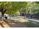 Landscaped community path with bench seating and mature trees offering shade at 385 Ralph Mcgill Ne Blvd # D, Atlanta, GA 30312