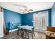 Cozy dining area with blue accent wall and access to balcony for relaxing and taking in the outdoor scenery at 385 Ralph Mcgill Ne Blvd # D, Atlanta, GA 30312