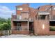 Brick townhouse with balconies on a sunny day showcasing its unique architectural design and urban living at 385 Ralph Mcgill Ne Blvd # D, Atlanta, GA 30312