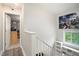 Bright hallway featuring hardwood floors, natural light, and a modern art piece at 385 Ralph Mcgill Ne Blvd # D, Atlanta, GA 30312