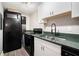 Kitchen with black appliances and green countertops and white cabinets at 385 Ralph Mcgill Ne Blvd # D, Atlanta, GA 30312