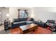 Cozy living room with a comfortable gray sectional sofa, wooden coffee table, and bright area rug at 385 Ralph Mcgill Ne Blvd # D, Atlanta, GA 30312