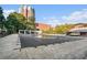 Outdoor community pool area featuring a covered pool, lounge seating, and brick buildings at 385 Ralph Mcgill Ne Blvd # D, Atlanta, GA 30312