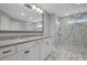 Bright bathroom featuring double vanity, a large mirror, and a walk-in shower at 541 Glen Abbey Se Cir, Mableton, GA 30126