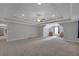 Large bonus room with tray ceiling, recessed lighting, and plush carpet at 541 Glen Abbey Se Cir, Mableton, GA 30126