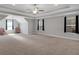 Spacious bonus room with tray ceiling, ceiling fan, and plenty of natural light at 541 Glen Abbey Se Cir, Mableton, GA 30126