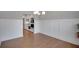 Bright dining room with wainscoting, hardwood floors, chandelier, and an open view to the kitchen at 541 Glen Abbey Se Cir, Mableton, GA 30126