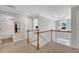 Hallway overlooking stairway with views of a bathroom and office at 541 Glen Abbey Se Cir, Mableton, GA 30126