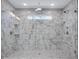 Stunning walk-in shower featuring marble tile surround and dual shower heads at 541 Glen Abbey Se Cir, Mableton, GA 30126