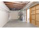 Unfinished basement with exposed ductwork, water heater, and access doorway at 5415 Tracey Dr, Stone Mountain, GA 30088