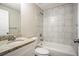 Bathroom features a granite countertop, decorative tiled shower, and modern fixtures at 5415 Tracey Dr, Stone Mountain, GA 30088
