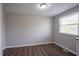 Bright bedroom featuring a large window with natural light and hardwood floors at 5415 Tracey Dr, Stone Mountain, GA 30088