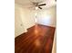 Spacious bedroom with a ceiling fan and glossy hardwood floors at 208 Doane St, Atlanta, GA 30315