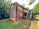 Brick apartment building showcasing wooden stairs and a view of the green lawn surrounding the property at 208 Doane St, Atlanta, GA 30315