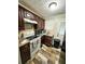 Kitchen featuring wooden cabinets, stone countertops, and appliances at 208 Doane St, Atlanta, GA 30315