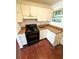 Small kitchen with white cabinets and black stove at 208 Doane St, Atlanta, GA 30315