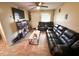 Inviting living room featuring leather furniture, wood-look floors, and neutral paint at 208 Doane St, Atlanta, GA 30315