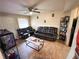Cozy living room with tile floors, ceiling fan, and black leather couches at 208 Doane St, Atlanta, GA 30315