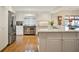 Modern kitchen with stainless steel appliances, white cabinetry, and hardwood floors at 2262 Rushmore Dr, Marietta, GA 30062