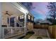 Home's backyard at dusk featuring a beautiful balcony and fireplace with additional living space above the garage at 431 Clifton Ne Rd, Atlanta, GA 30307